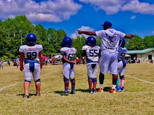 Douglasville Tiger Cubs youth football players in uniform on the practice field
